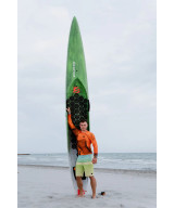 Bass rider holding a California Pro rigid SUP board on the beach